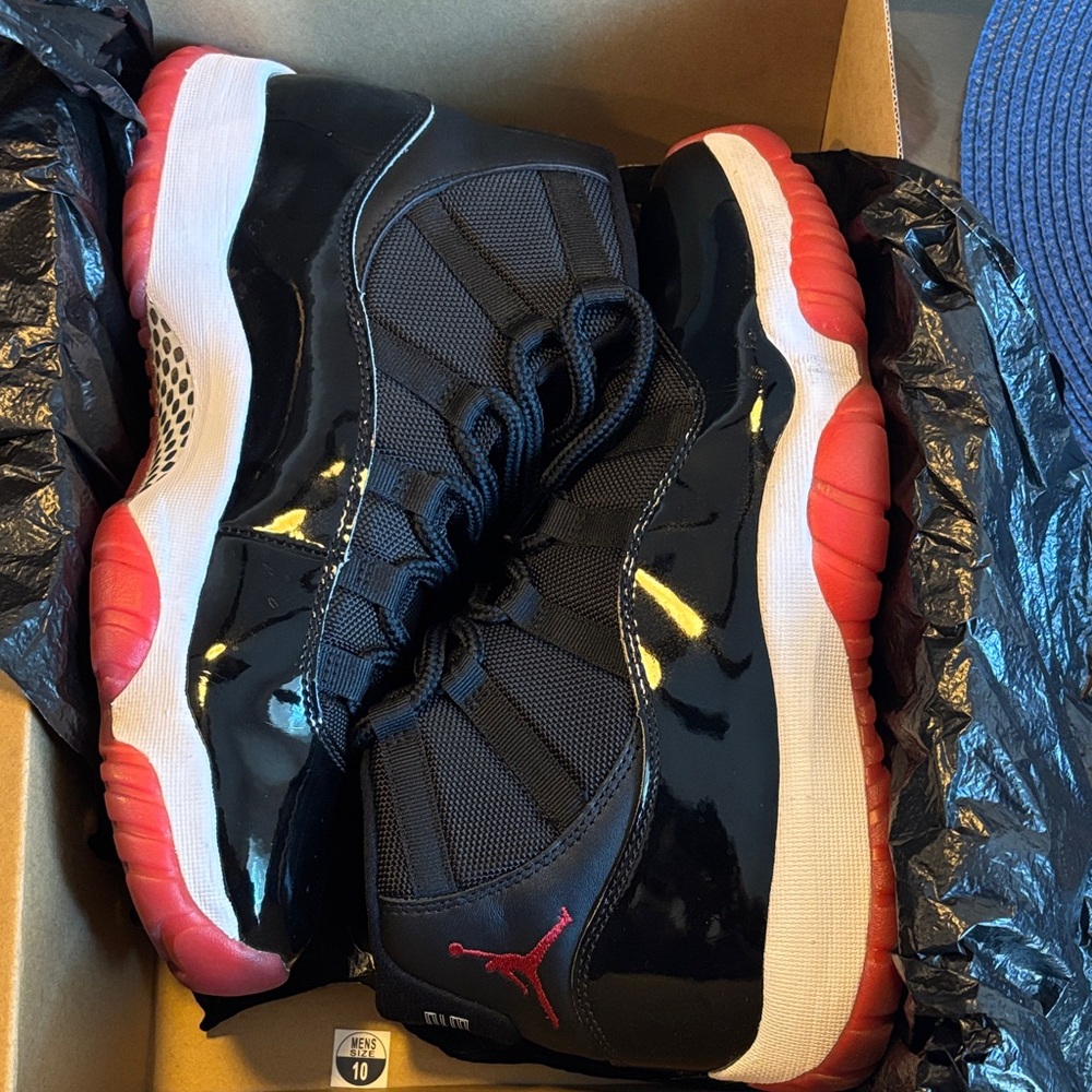 Air Jordan 11s - Black and Red Sneakers